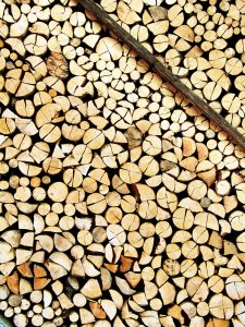 A nicely stored stock of cut wood supported by a narrow bar – resource for a long winter. Great for backgrounds and wallpapers.